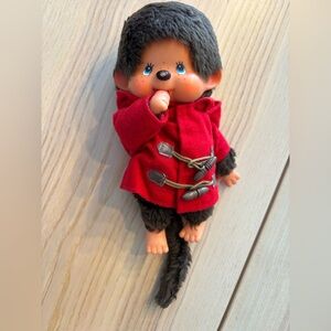 Vintage 1974 Monchichi monkey plush with hooded red coat (H)